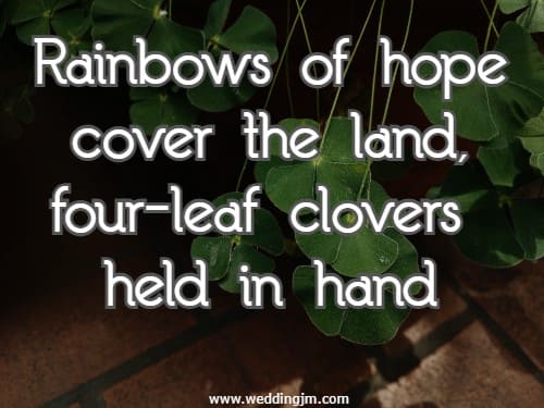 Rainbows of hope cover the land, four-leaf clovers held in hand.